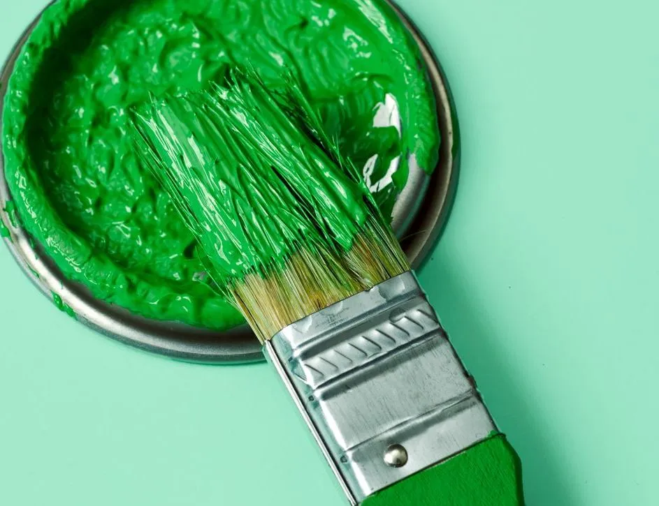 Green eco-friendly paint with brush
