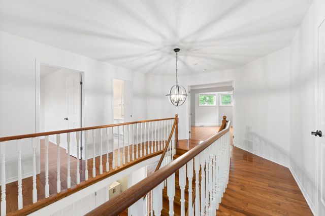Bright hallway and stairs with refreshed railing