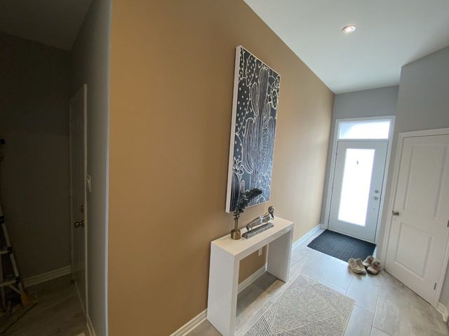 Entryway with fresh, warm coat and trim details